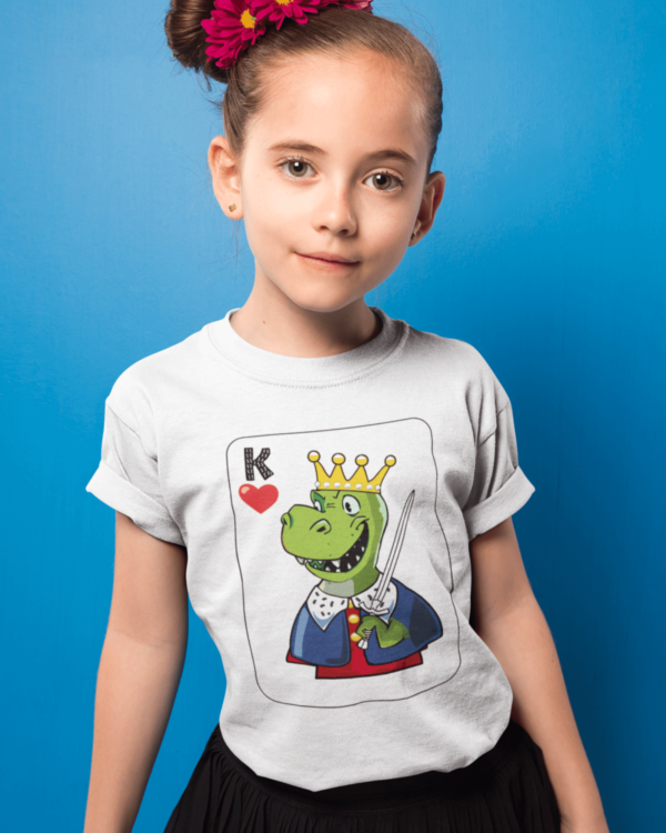 girl wearing a shirt with a dinosaur king playing card