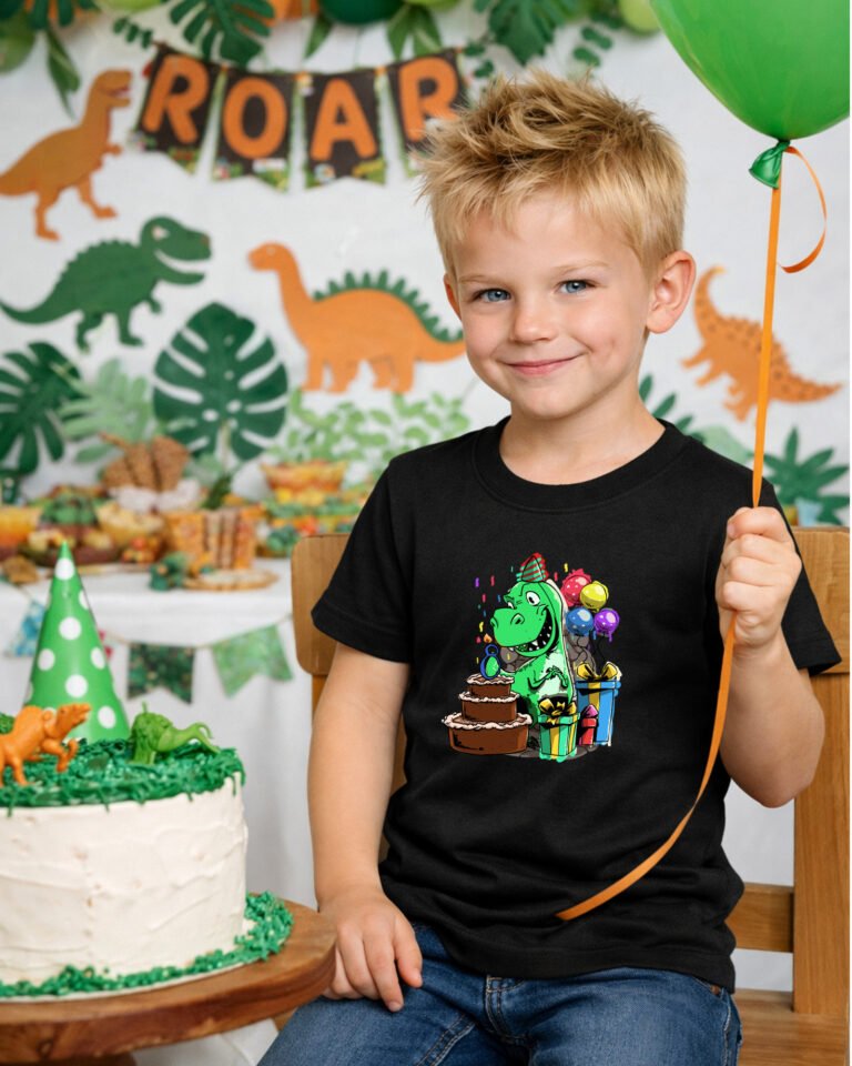 boy wearing a birthday shirt with a dinosaur on it