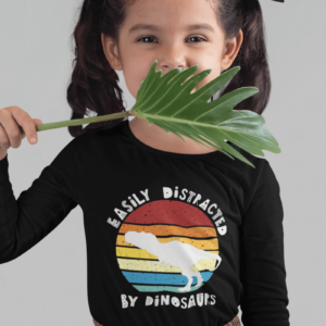 cute girl weaing a dinosaur t shirt