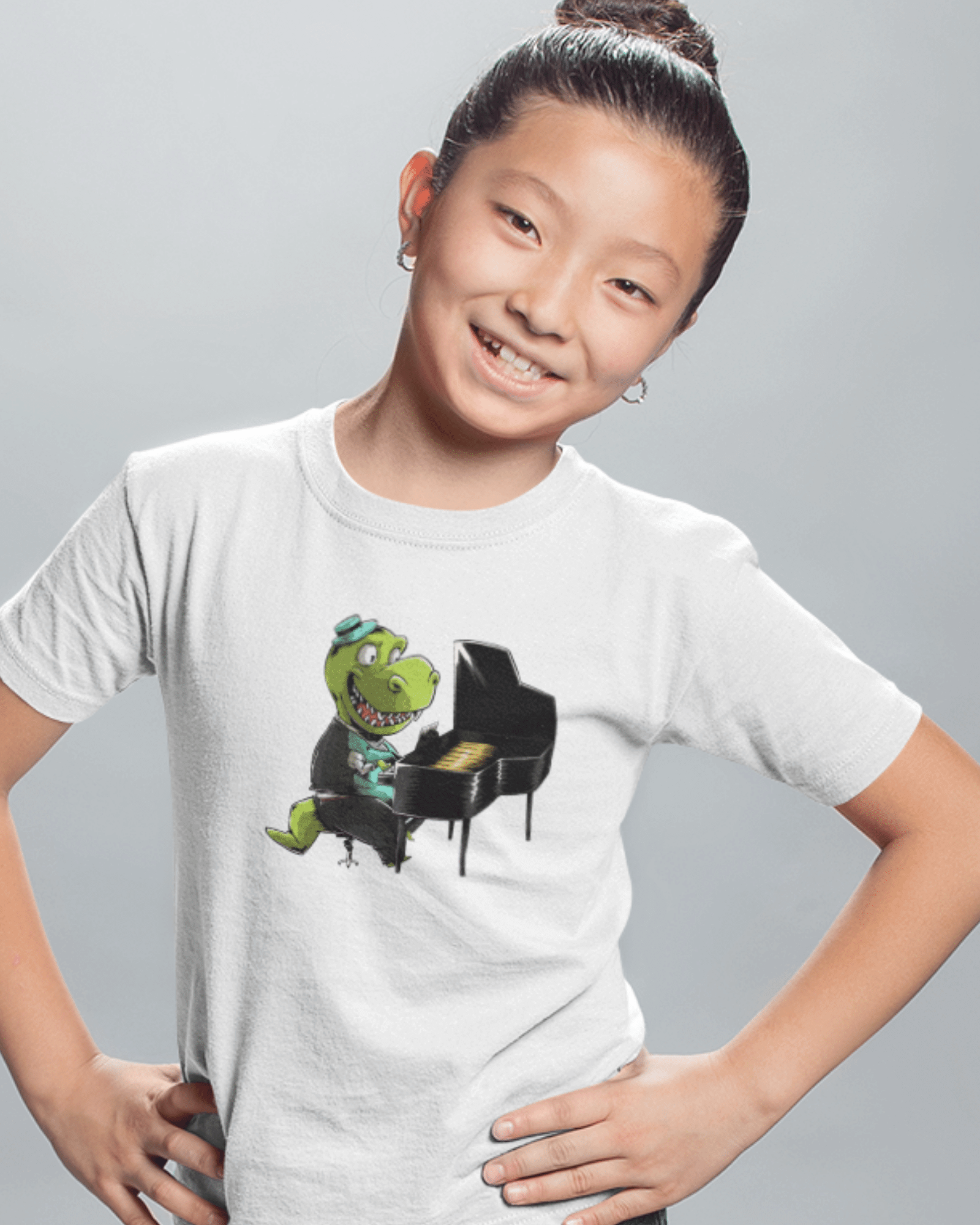 girl wearing a t shirt with a piano playing dinosaur
