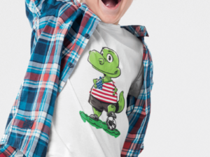 photo shows a boy wearing a soccer shirt with a dinosaur