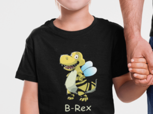 boy wearing a dinosaur shirt with a bee rex on it