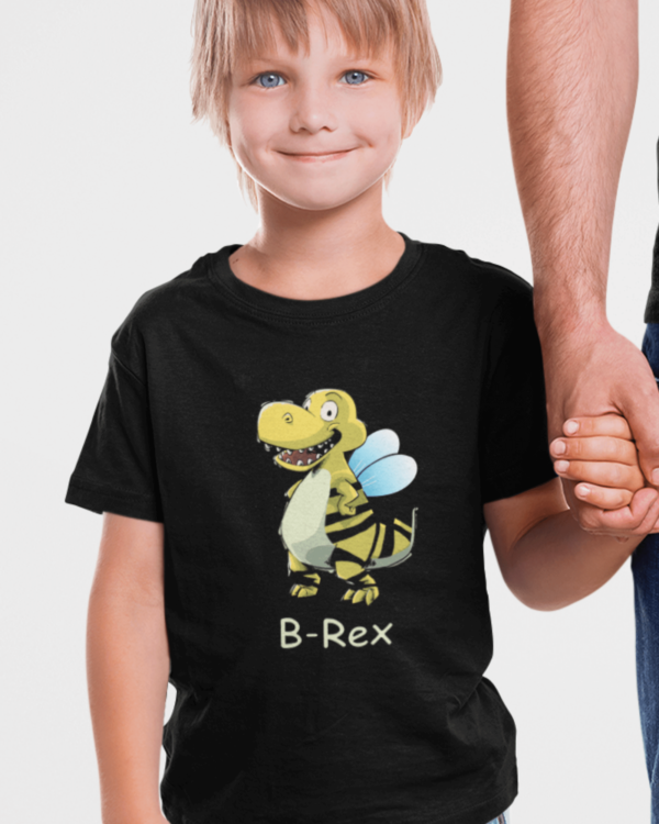 boy wearing a dinosaur shirt with a bee rex on it